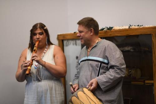 Courtney Cater playing cedar flute accompanied by Dr. Damm on drum